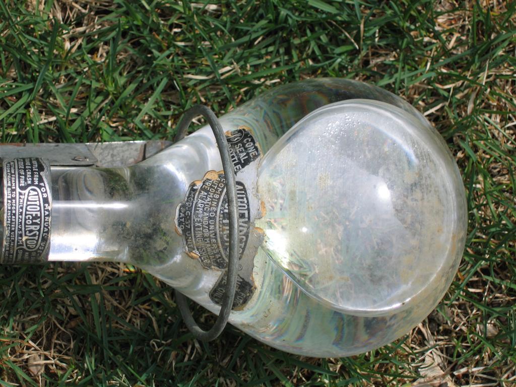 AutoFyrStop Co. Grenade Bottle. Clear with liquid