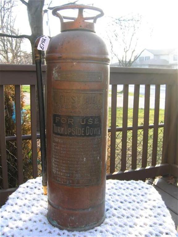 Fire Extinguisher. Copper. 23 1/2 inches tall.