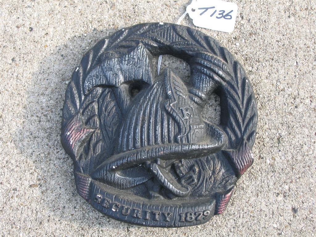 Plaque. Fire Helmet in center with F.D. 9 on shie