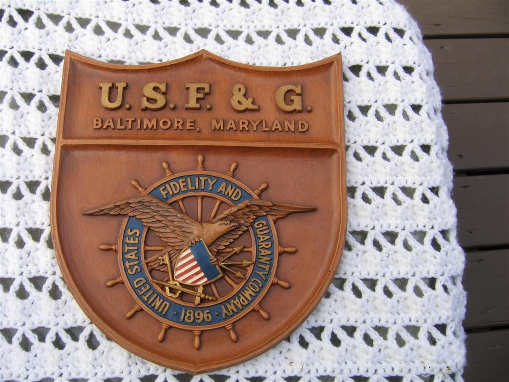 U.S.F & G Shield Shaped Plaque. Wood. 11x12 1/4.