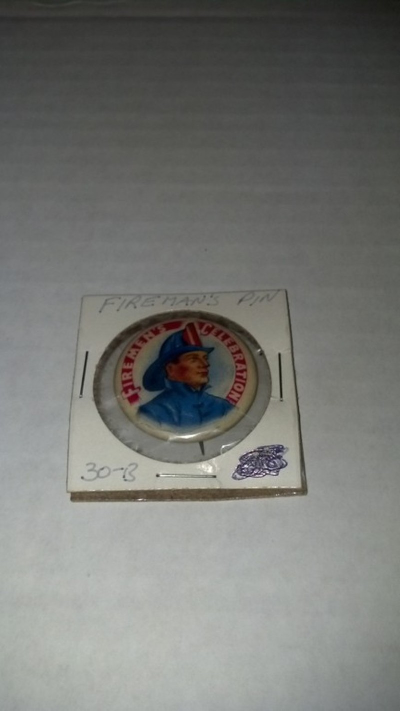 Fireman Pin. 1.25" Pin Back Button Showing a Fire