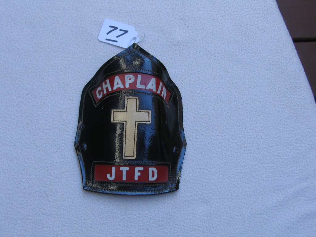 Fireman's Helmet Shield. "CHAPLAIN" and "JTFD" wi