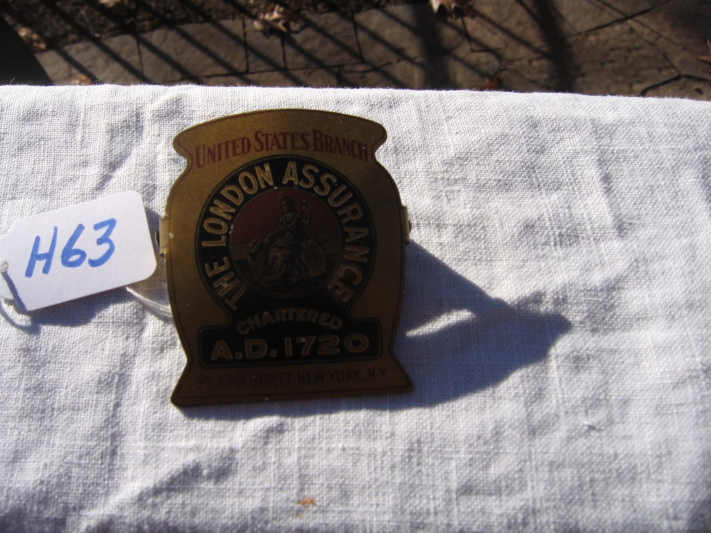 London Assurance Paper Clip. Gold Background with