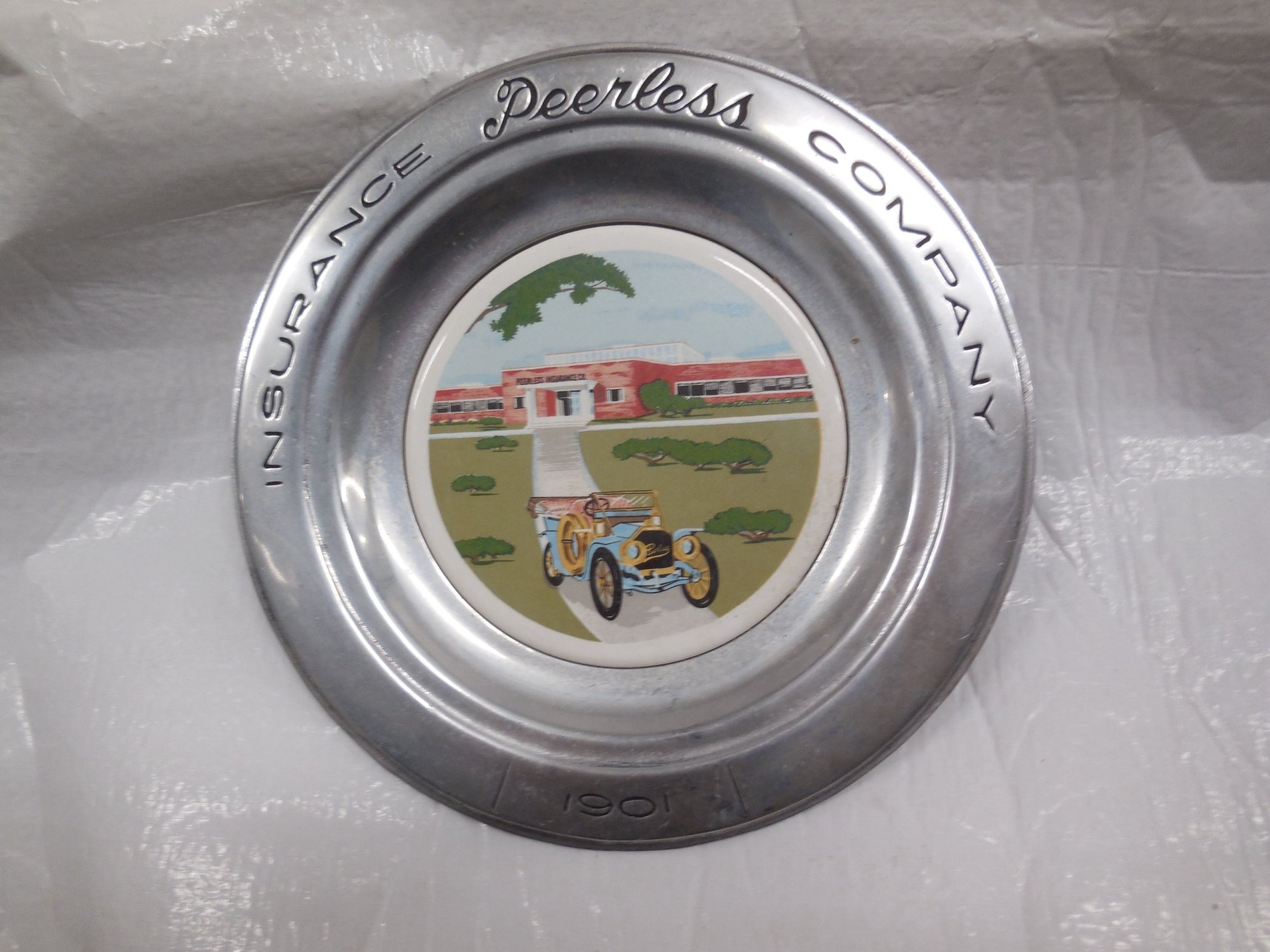 Peerless Insurance company plate