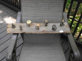 7 Antique Sprinkler Heads mounted on an old barn b