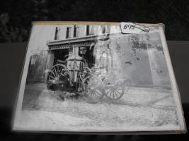 Black and White Photograph of Fire Engine with Fir
