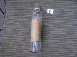 Pyrofite Fluid Fire Extinguisher glass container.