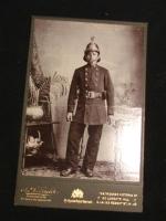 Old Cabinet Card showing British Fireman in his fu