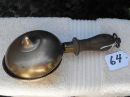 Brass Muffin Bell with Wood handle. The inside of