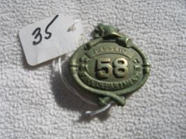 Passaic Fire Department Uniform Badge. Number 58.