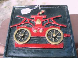 Fire Truck Pumper Raised on Black Metal. Reproduc